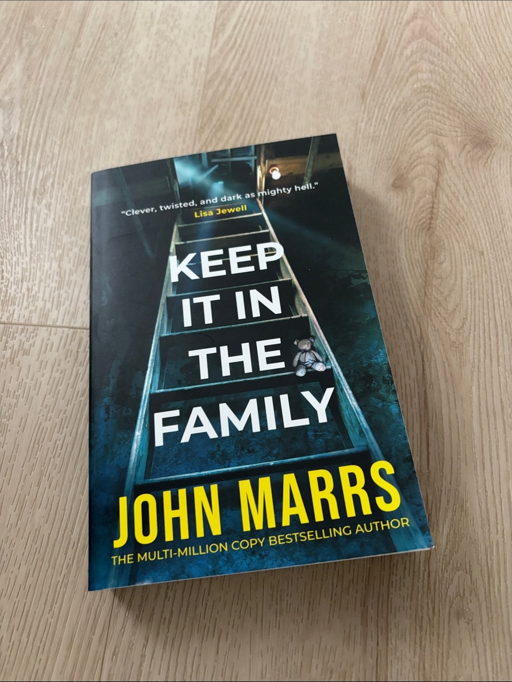 Keep It In The Family by John Marrs - Dark Teal & Yellow Paperback